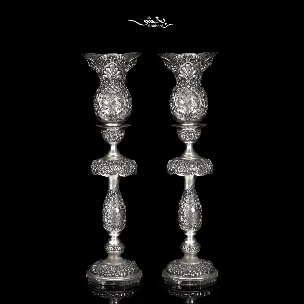 شمعدان نقره لاله بدون آویز مینیاتور و گل برجسته اعلا با ارتفاع 53 سانتیمتر و وزن 2417.3 گرم نقره با عیار 90 درصد موجود در شعب حضوری و سایت نقره بخشی.